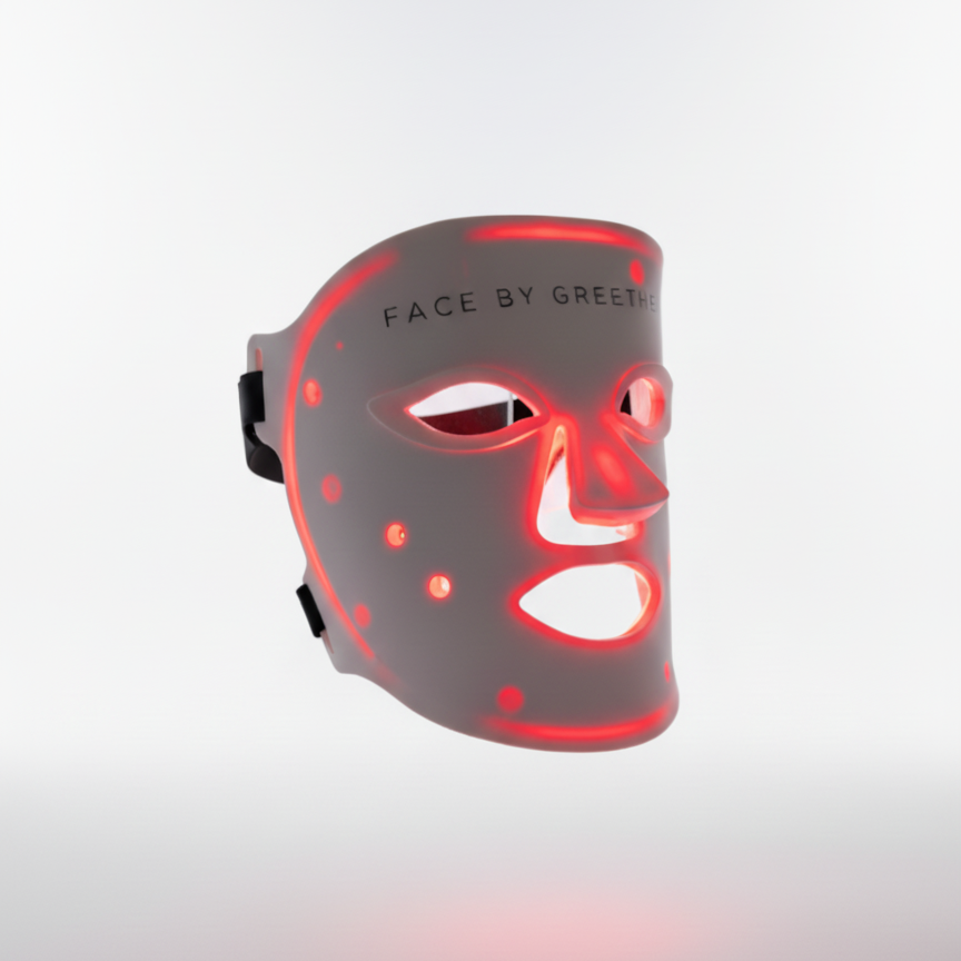 Red light LED face mask on a clear stand with &